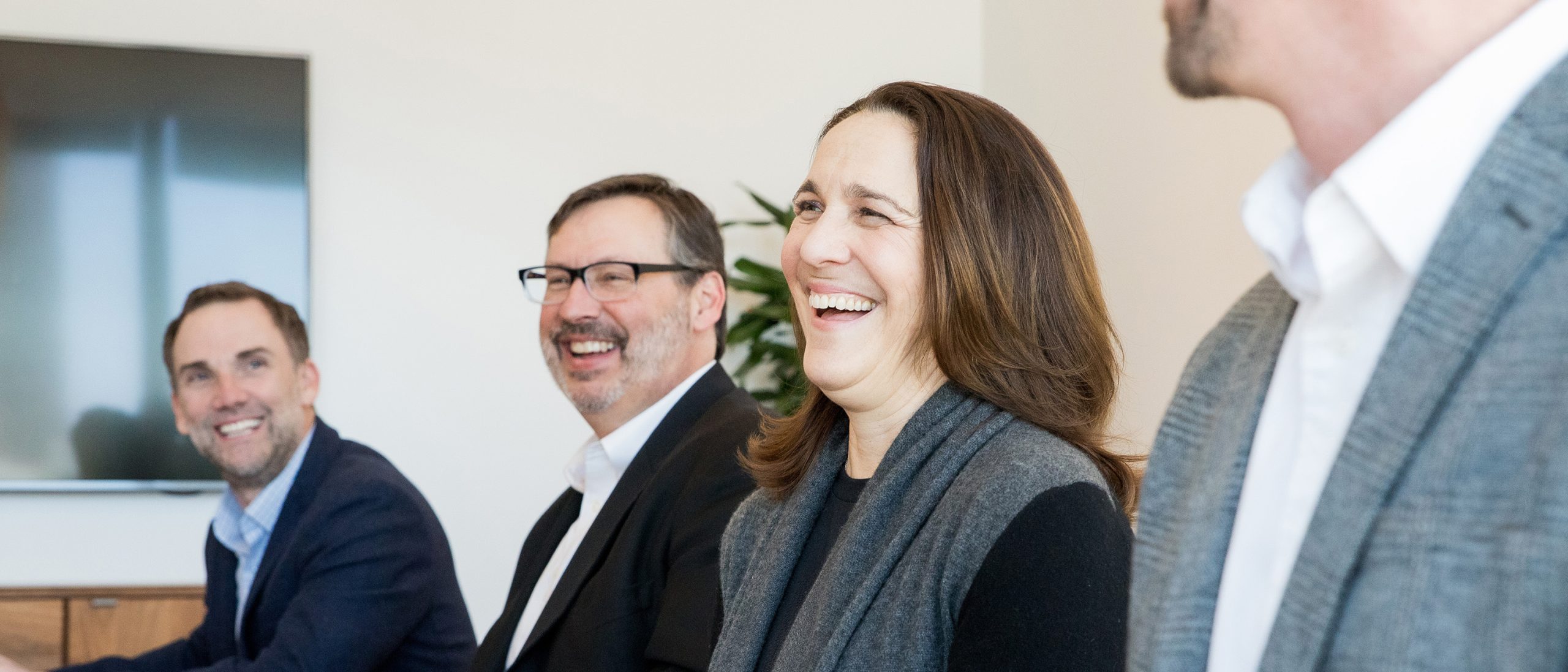 Woman smiling in a meeting