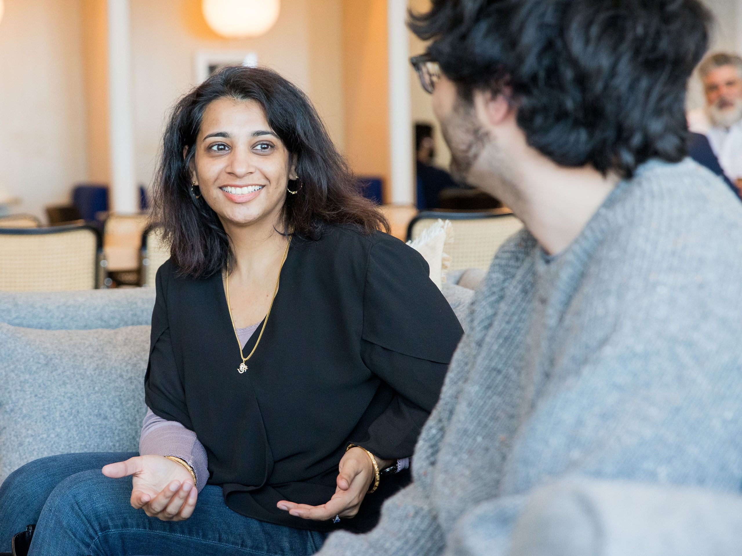 Woman talking with a client in lobby