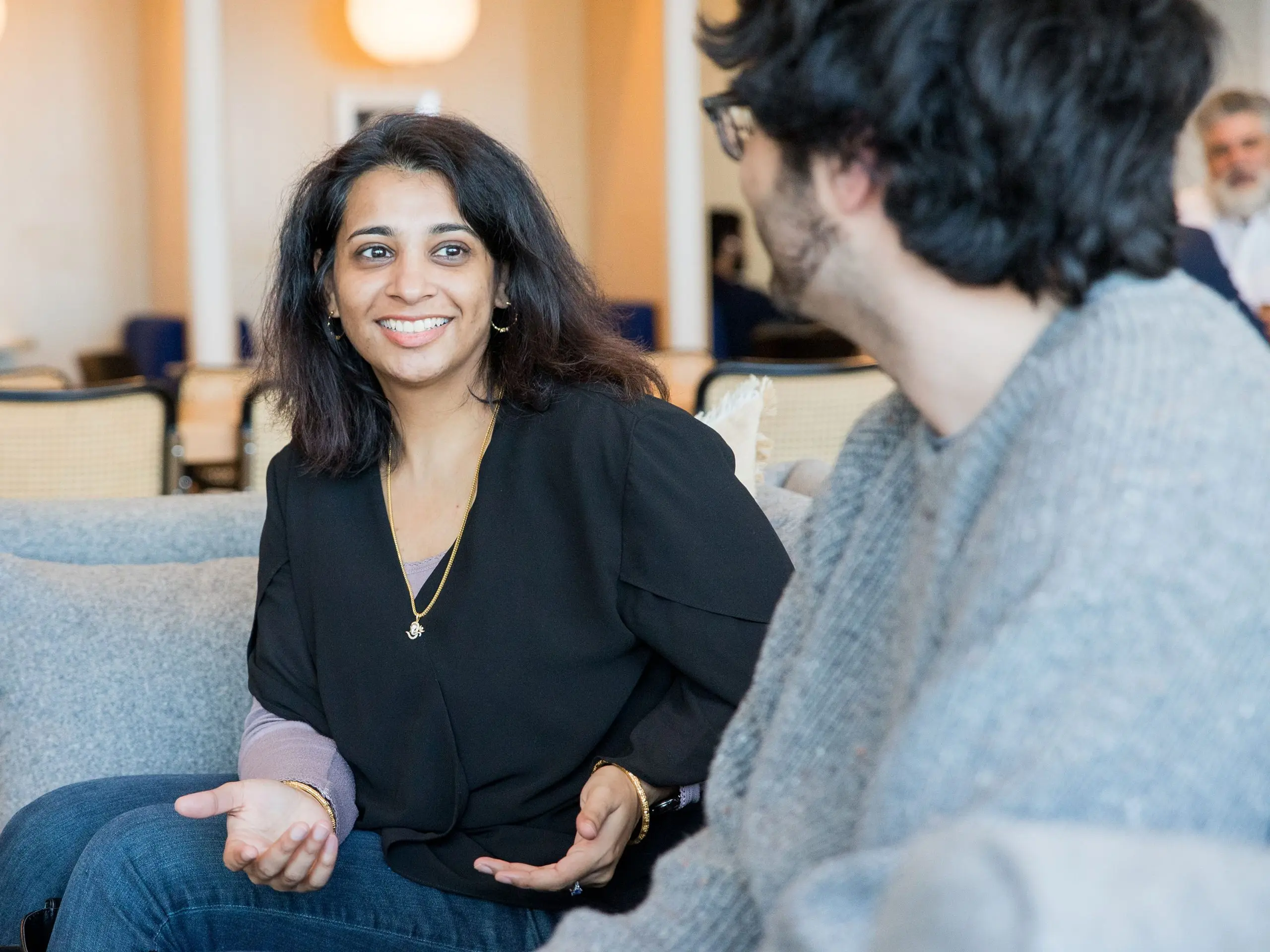 Woman talking with a client in lobby