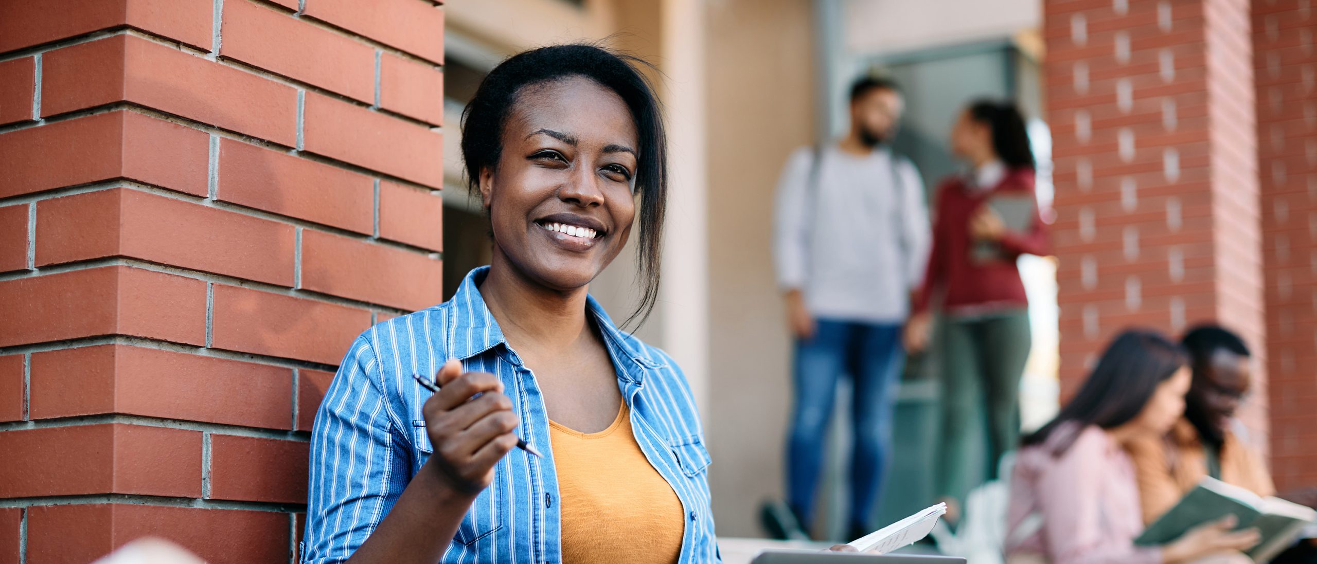 Woman sitting outside smiling