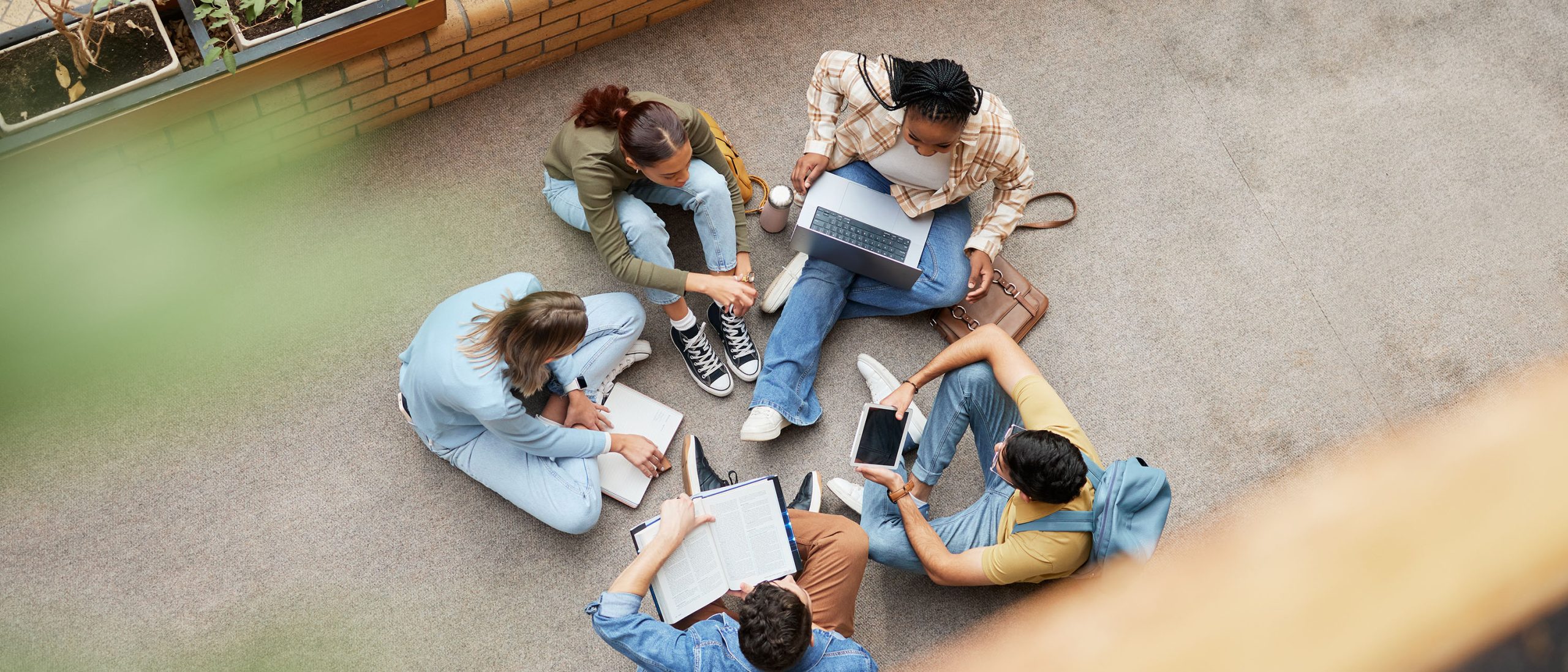 College students sitting in a circle talking