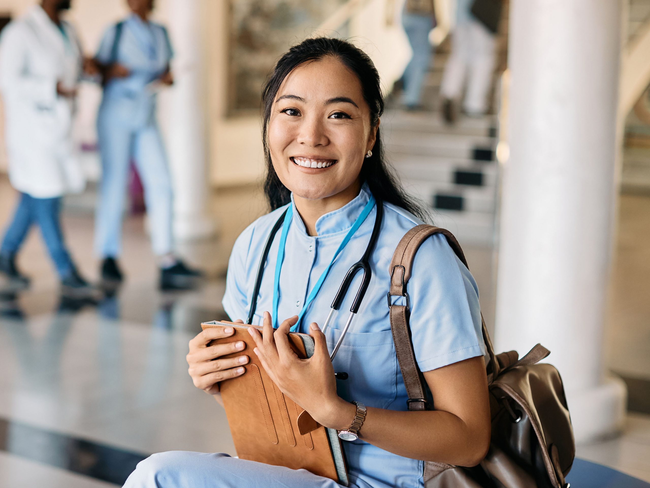 Female Medical student sitting on bench