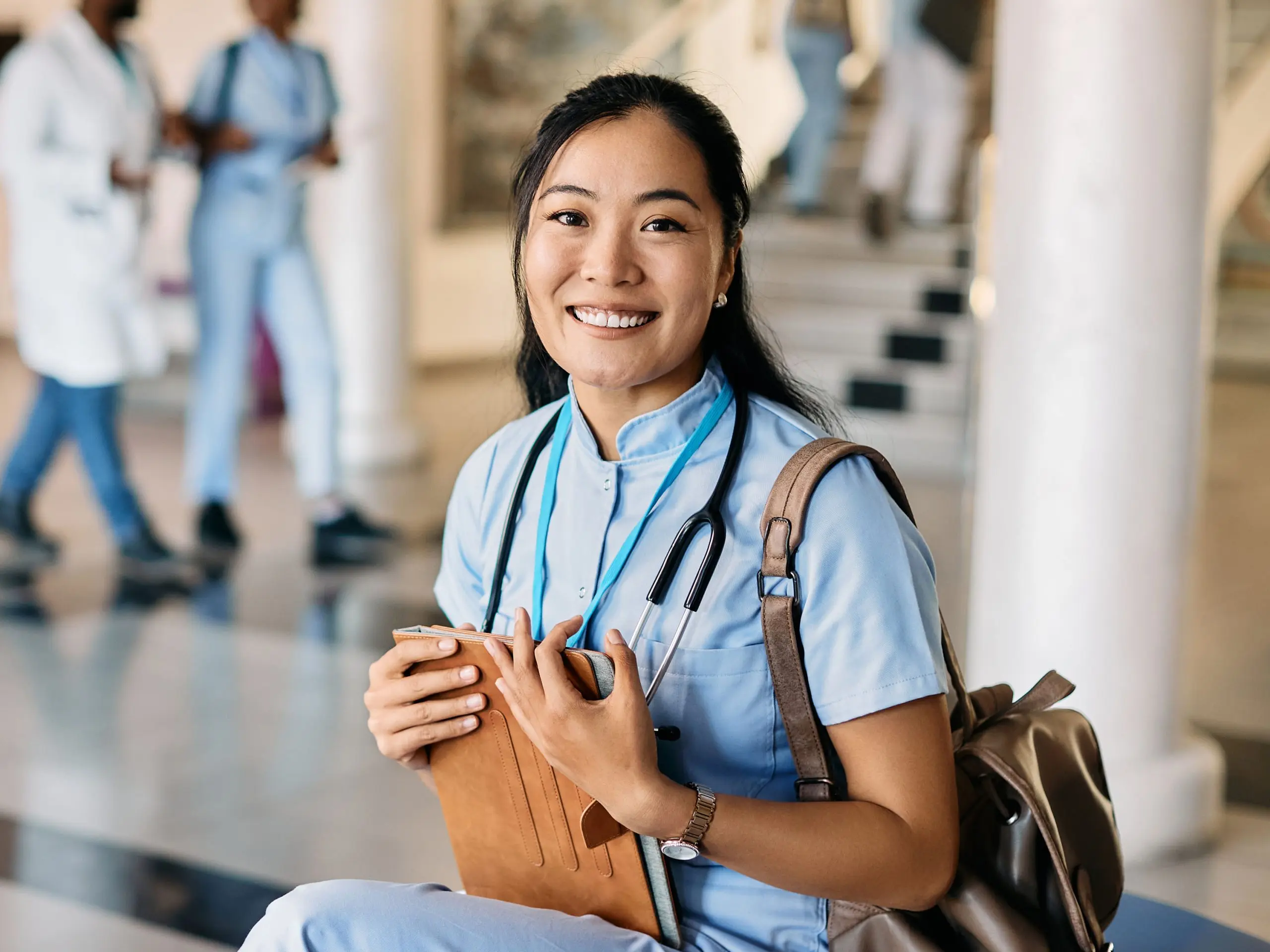 Female Medical student sitting on bench