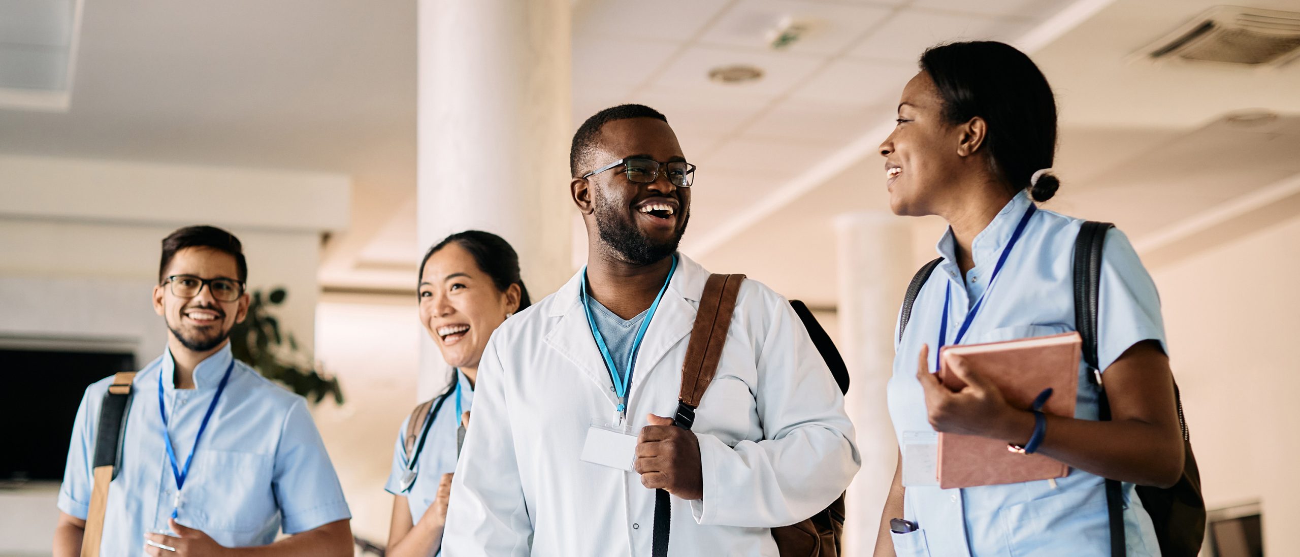Medical students walking through hall