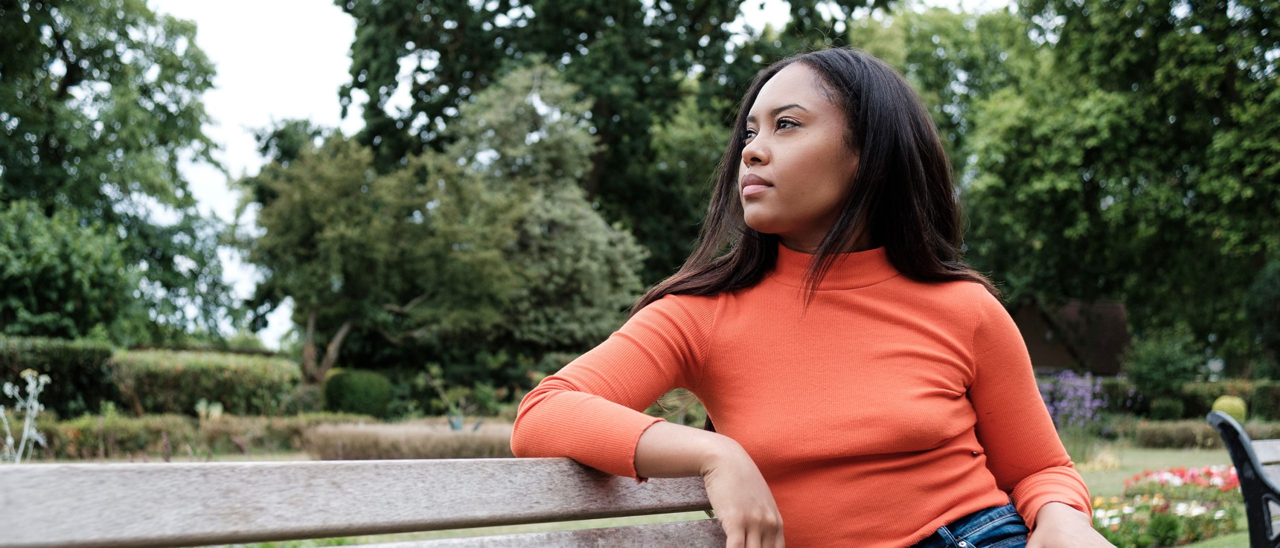 Woman sitting on park bench