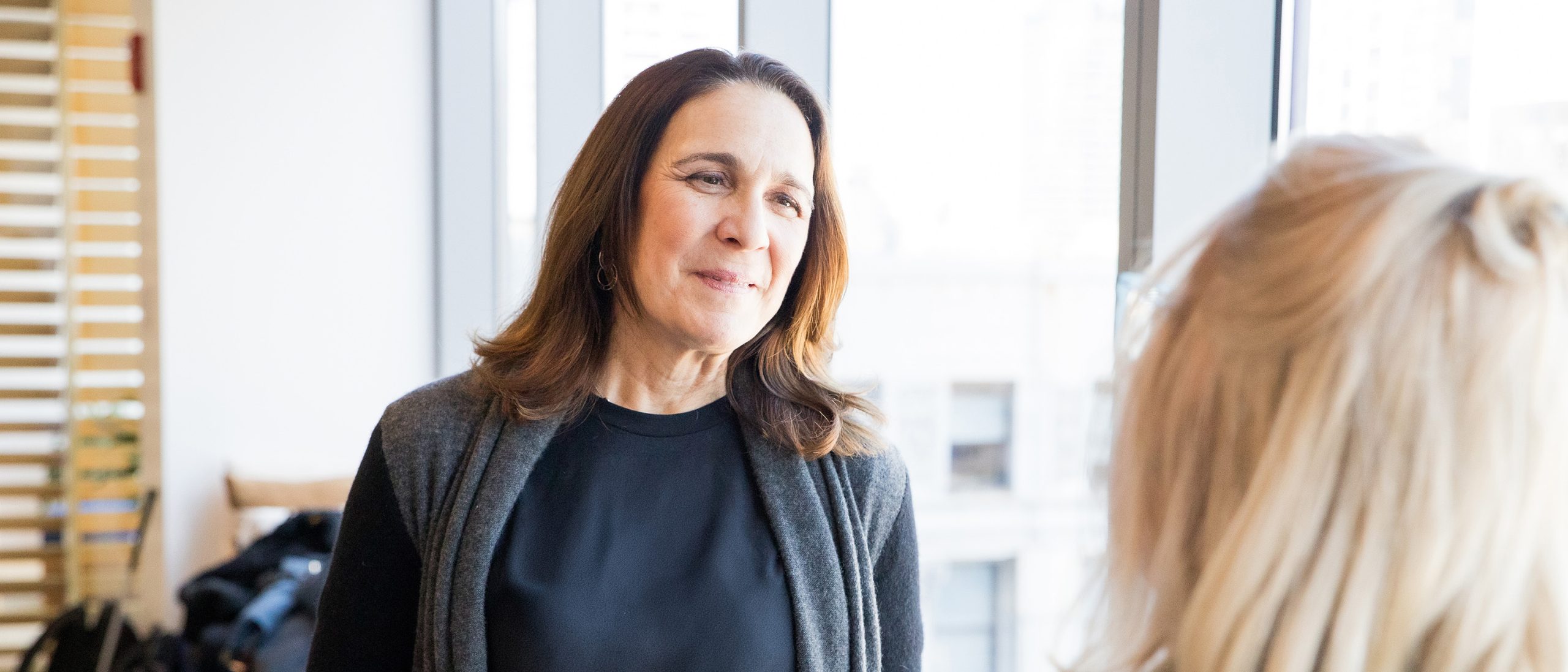 Women talking in office
