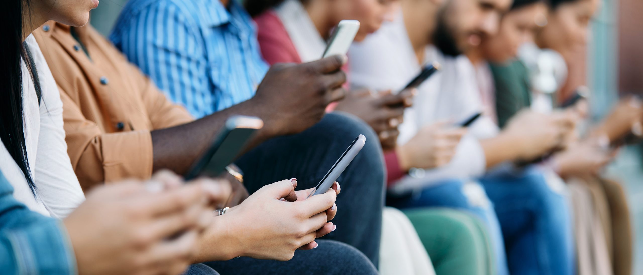 Students on their phones on campus