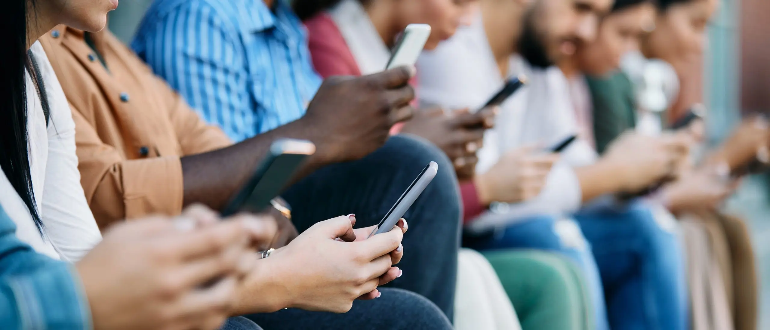 Students on their phones on campus